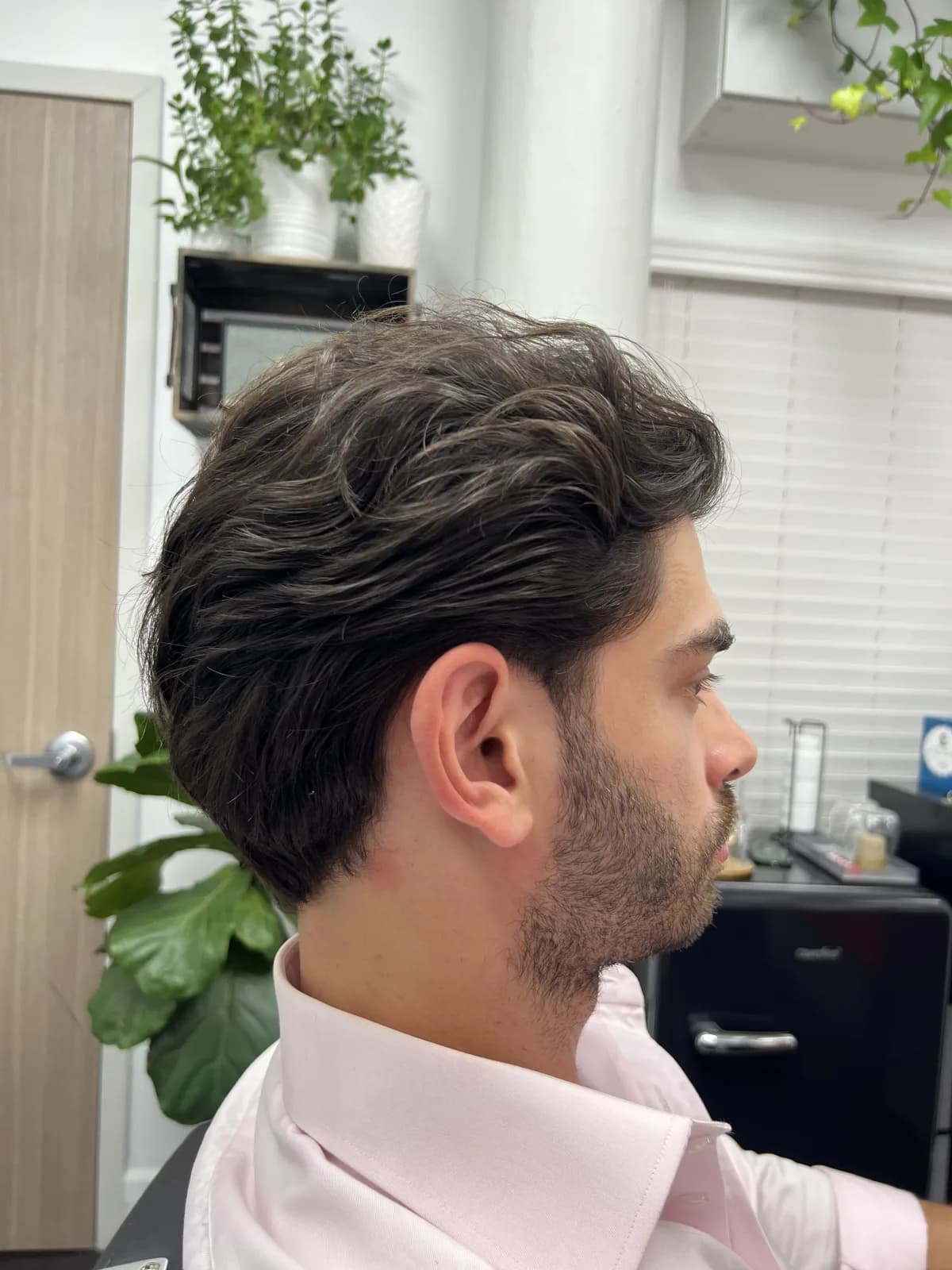 Finished cut — textured length swept back, side profile