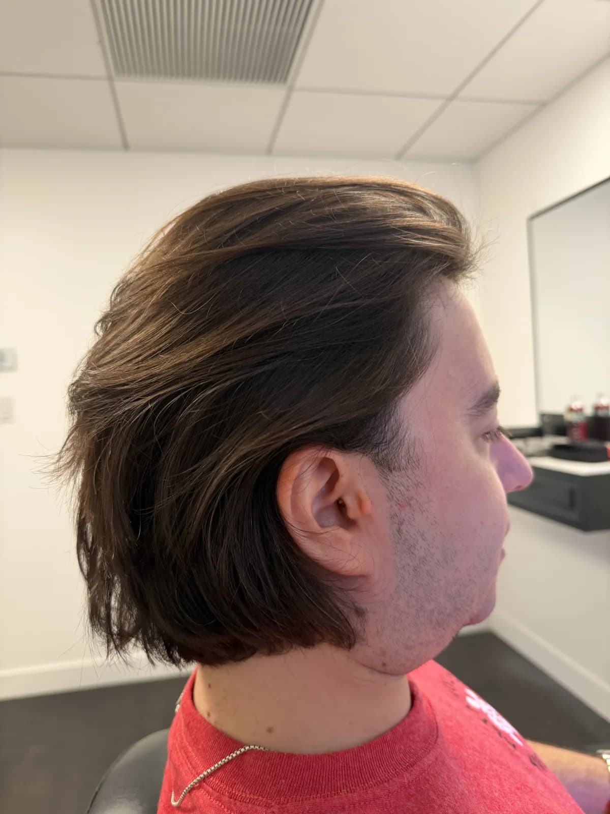 Finished cut — longer length swept off the face